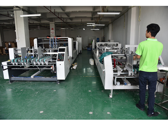 Folding and gluing machine